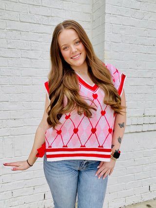 Heart Knit Sweater Vest with Bows- BOW, Bow detail, bow sweater, BOWS, clothing, HEART, heart sweater, HEARTS, knit sweater, knit vest, pink, pink sweater, RED, RED SWEATER, ribbon, Ribbons, Seasonal, sweater top, SWEATER VEST, SWEATER., sweaters, Tops, VALENTINE, Valentine Collection, valentine pullover, VALENTINES, VALENTINES GRAPHIC TEE, valentines sweatshirt, VALENTINES TOP, VEST-Ace of Grace Women's Boutique