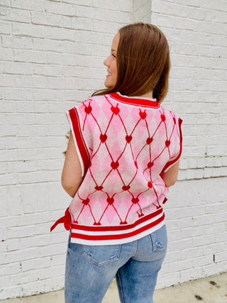 Heart Knit Sweater Vest with Bows- BOW, Bow detail, bow sweater, BOWS, clothing, HEART, heart sweater, HEARTS, knit sweater, knit vest, pink, pink sweater, RED, RED SWEATER, ribbon, Ribbons, Seasonal, sweater top, SWEATER VEST, SWEATER., sweaters, Tops, VALENTINE, Valentine Collection, valentine pullover, VALENTINES, VALENTINES GRAPHIC TEE, valentines sweatshirt, VALENTINES TOP, VEST-Ace of Grace Women's Boutique