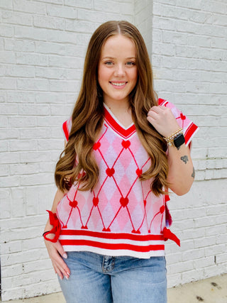 Heart Knit Sweater Vest with Bows- BOW, Bow detail, bow sweater, BOWS, clothing, HEART, heart sweater, HEARTS, knit sweater, knit vest, pink, pink sweater, RED, RED SWEATER, ribbon, Ribbons, Seasonal, sweater top, SWEATER VEST, SWEATER., sweaters, Tops, VALENTINE, Valentine Collection, valentine pullover, VALENTINES, VALENTINES GRAPHIC TEE, valentines sweatshirt, VALENTINES TOP, VEST-Ace of Grace Women's Boutique